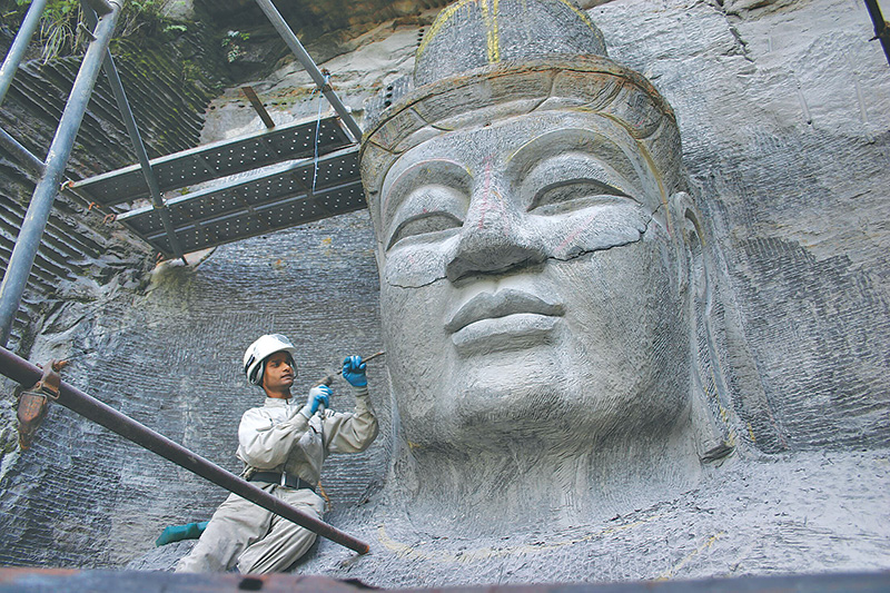 Nepal artisans working on a giant Buddha in Japan