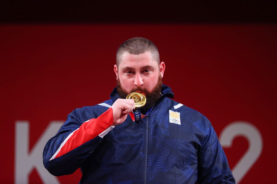 Georgia's Talakhadze breaks world record to conquer men's super heavyweight class