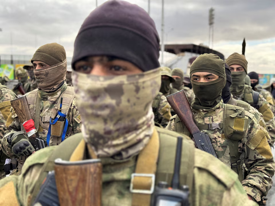 Syria appoints some foreign Islamist fighters to its military, sources say