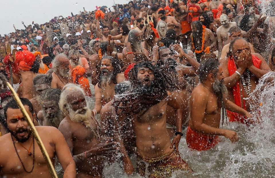 India’s Maha Kumbh marks first ‘royal bath’ with dreadlocked ascetics’ holy dip